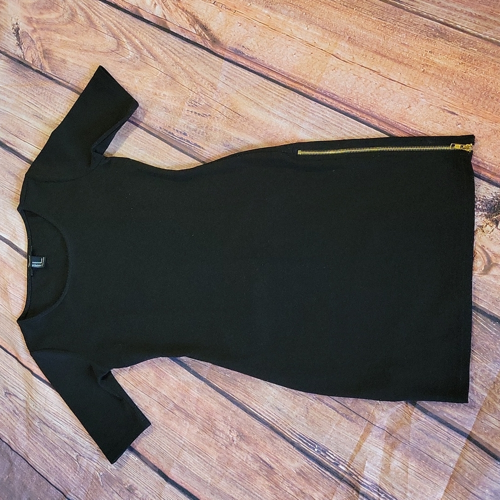 Black mini dress with gold zipper